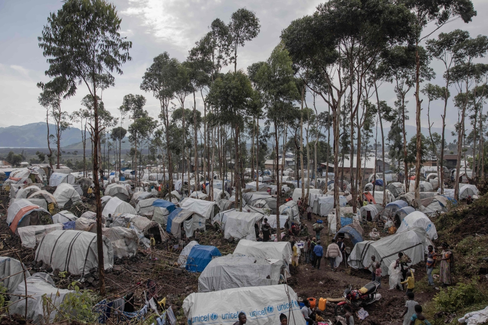 Newly displaced Congolese prepare to spend the night in the small houses they build next to the Bulengo camp a few kilometres from the centre of Goma, in the east of the Democratic Republic of Congo, on February 16, 2024. ― AFP pic