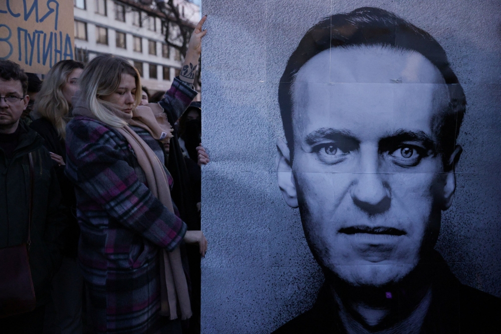 People gather outside the Russian embassy, following the death of Russian opposition leader Alexei Navalny, reported by prison authorities in Russia’s Yamalo-Nenets region where he had been serving his sentence, in Warsaw, Poland, February 16, 2024. ― Reuters pic