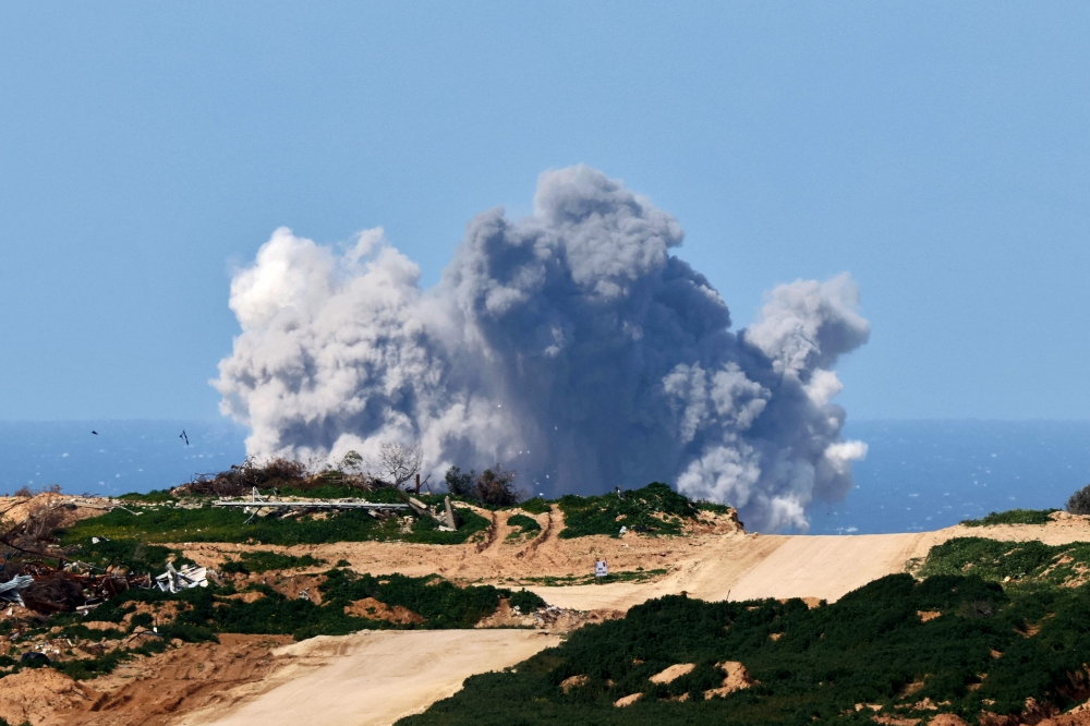 A picture taken from a position in southern Israel on February 16, 2024 shows smoke billowing following Israeli bombardment on the Gaza Strip, amid ongoing battles between Israel and Hamas. ― AFP pic