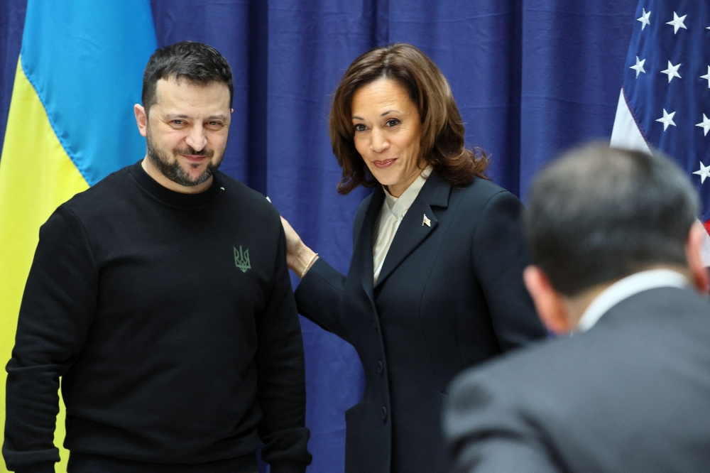 US Vice President Kamala Harris and Ukrainian President Volodymyr Zelenskiy pose for a photo as they attend a press conference during the Munich Security Conference (MSC) in Munich, Germany February 17, 2024. ― Reuters pic