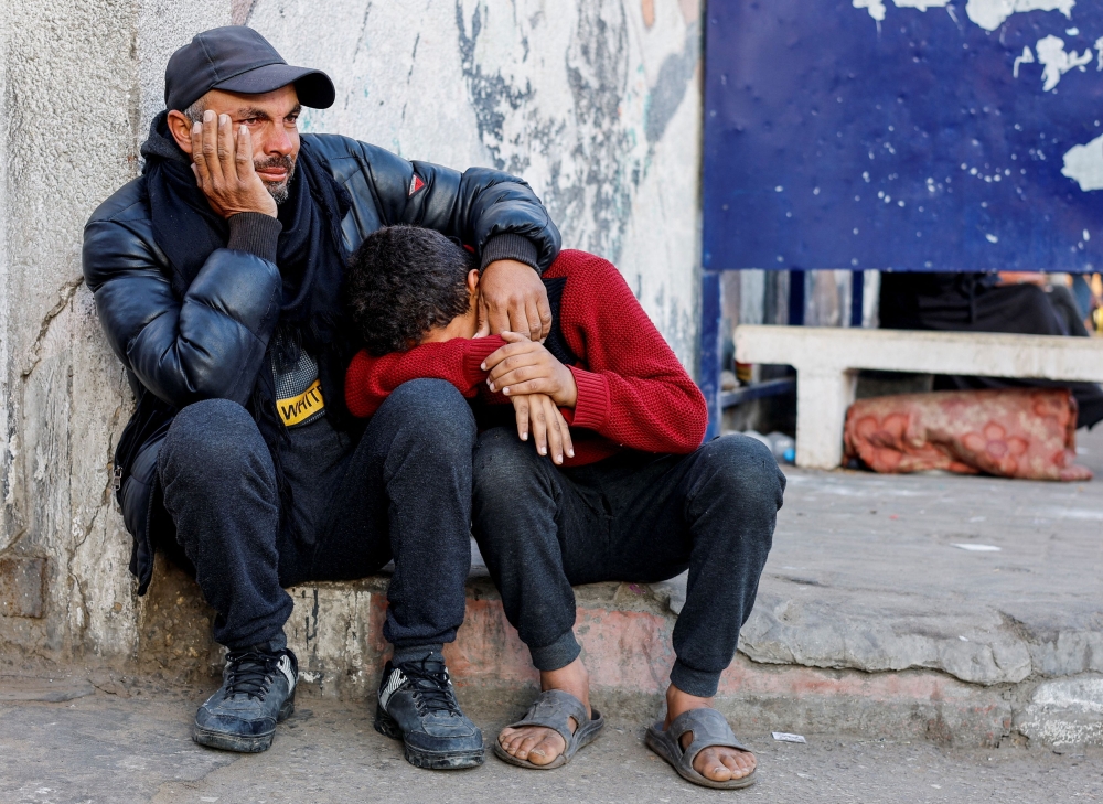 Mourners react as the bodies of Palestinians killed in Israeli strikes lie at Abu Yousef Al-Najjar hospital, amid the ongoing conflict between Israel and Palestinian Islamist group Hamas, in Rafah, in the southern Gaza Strip, February 18, 2024. — Reuters pic