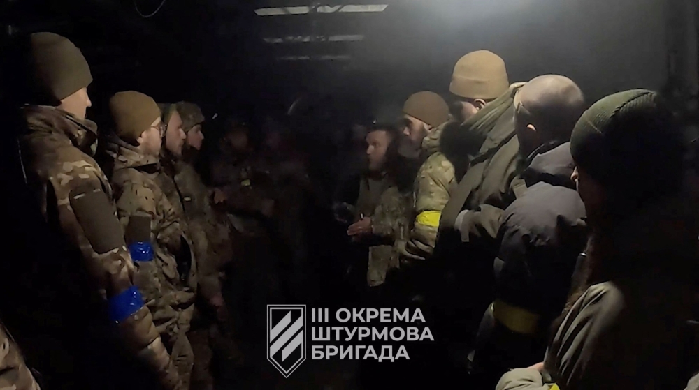 Ukrainian soldiers gather in a location given as Avdiivka, Donetsk Region, Ukraine, in this screen grab taken from a video released February 16, 2024. — 3Rd Assault Brigade handout via Reuters