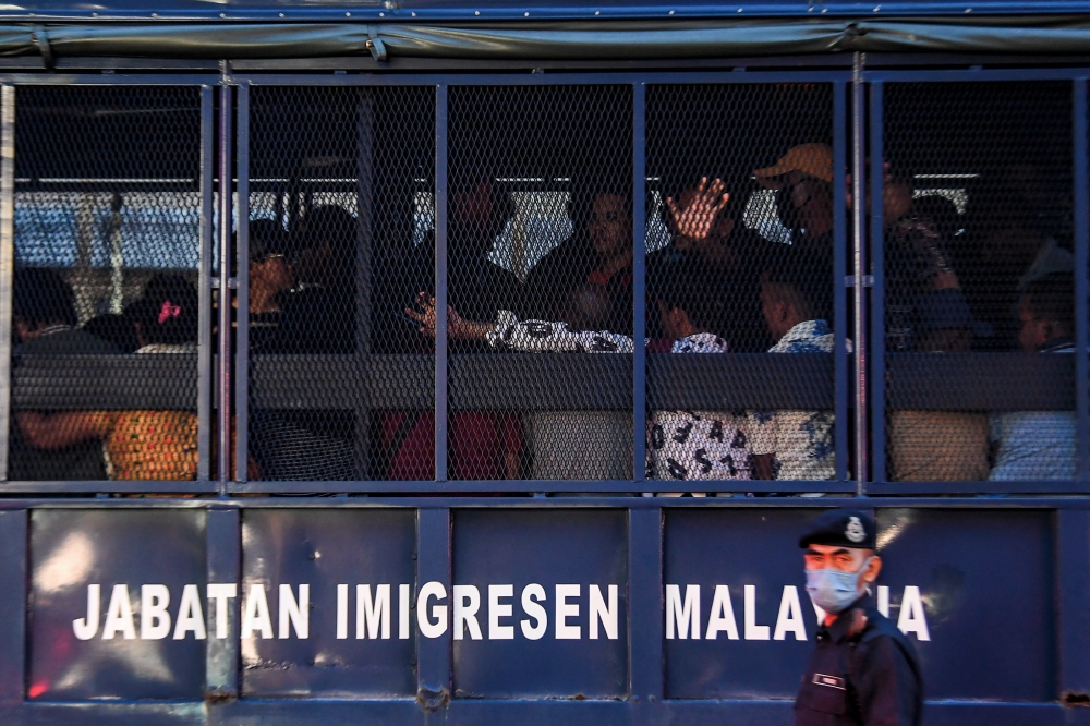 Foreigners who were arrested to be taken to the Immigration Detention Depot after failing to show identification documents during a joint operation by the Police, the Malaysian Immigration Department (JIM) of Negeri Sembilan and the Seremban City Council (MBS) in Seremban, February 18, 2024. — Bernama pic 