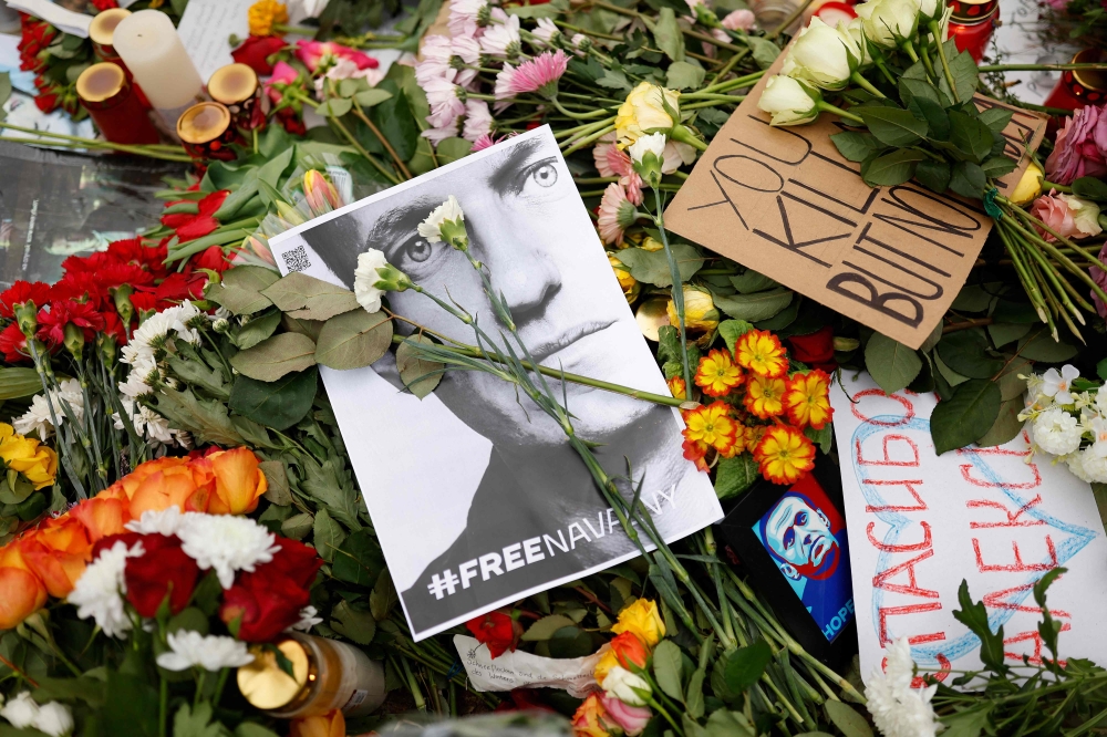 People lay flowers and candles at a memorial on February 18, 2024 in front of the Russian embassy in Berlin, following the death of the Kremlin's most prominent critic Alexei Navalny in an Arctic prison. — AFP pic