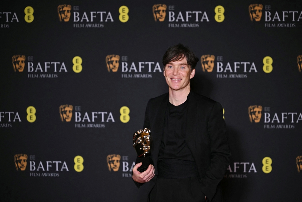 Irish actor Cillian Murphy poses with the award for Best leading actor for his role in 