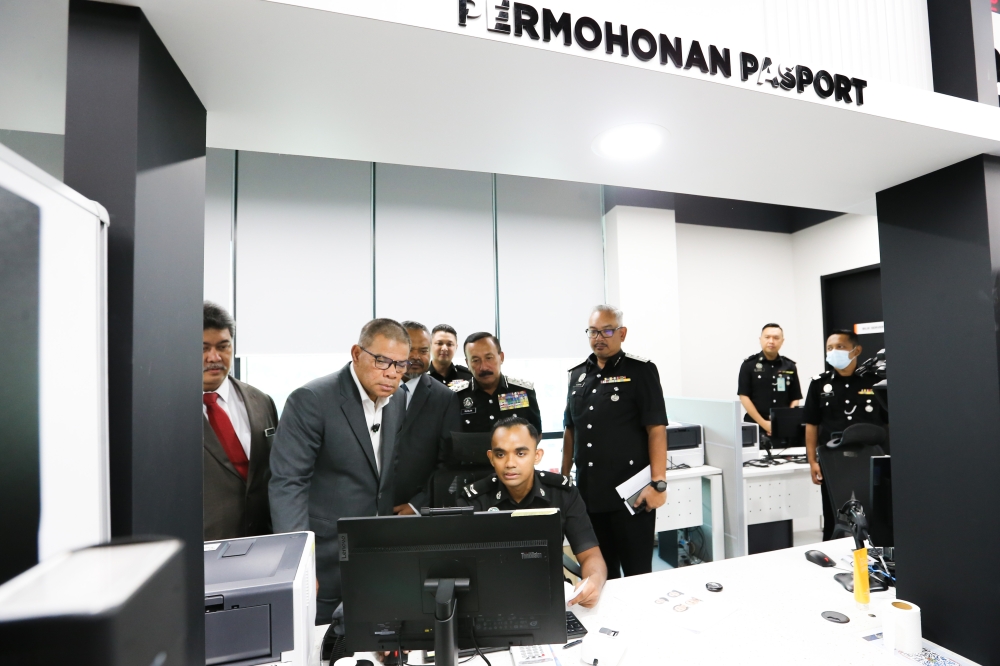 Home Minister Datuk Seri Saifuddin Nasution Ismail (second from left) at the opening of the new passport office at Skyfunnel Zone Shaftsbury Tower in Putrajaya February 19, 2024. — Picture by Miera Zulyana