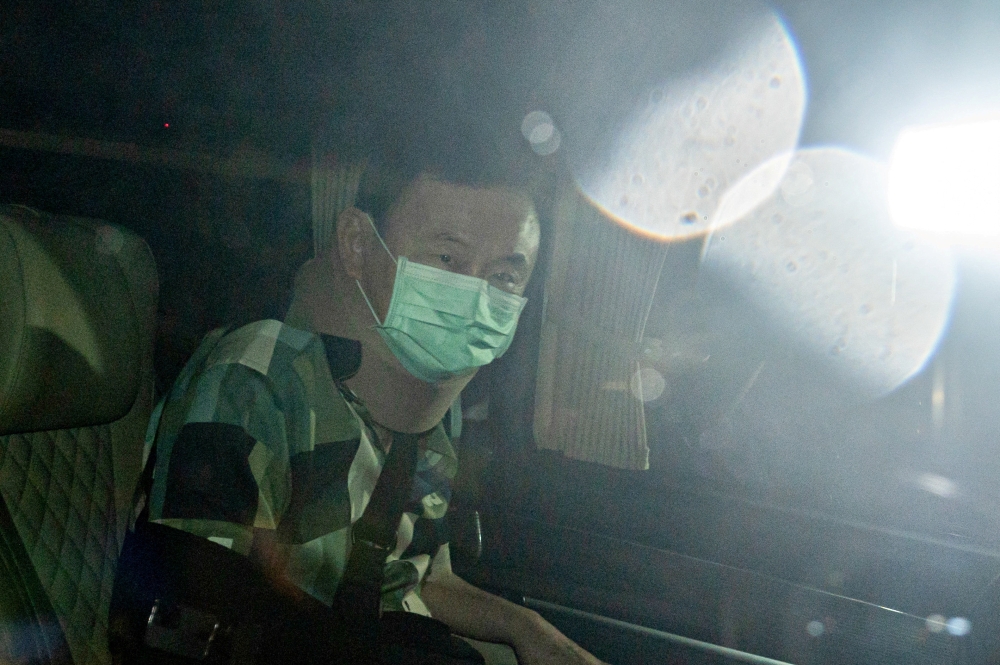 Thailand's former Prime Minister Thaksin Shinawatra leaves a police hospital after being granted parole, in Bangkok, Thailand, February 18, 2024. — Thai News Pix/Tananchai Kaewsowattana via Reuters pic