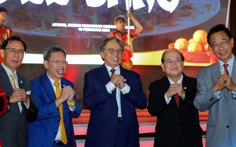Sarawak Premier Tan Sri Abang Johari Openg at the 2024 Chinese New Year ceremony organised by the Sarawak Premier’s Department at the State Legislative Assembly building in Kuching, February 19, 2024. With him are deputy premiers Datuk Amar Douglas Unggah and Datuk Amar Dr Sim Kui Hian. — Bernama pic 