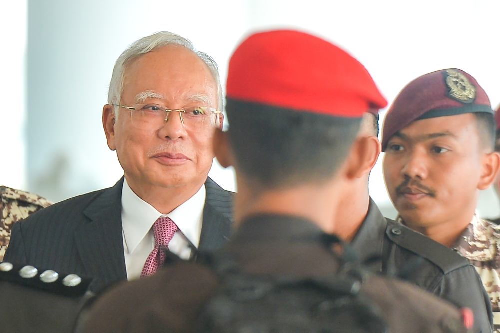 Former prime minister Datuk Seri Najib Razak was seen escorted by the Prisons Department personnel at the Kuala Lumpur Court Complex, February 19, 2024. —  Picture by Shafwan Zaidon
