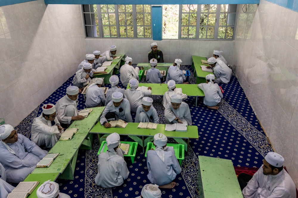 File picture of tahfiz students reading and memorising the Quran during the month of Ramadan at Darul Quran Ittifaqiyah in Keramat, Kuala Lumpur on April 13, 2022. Among other things, the NGOs said there was a need for a full hearing on their claim that the existence and maintenance of vernacular schools allegedly draw funding away from other schools under the Education Ministry, such as tahfiz schools which were said to have difficulty in obtaining financial allocation from the government. — Picture by Firdaus Latif
