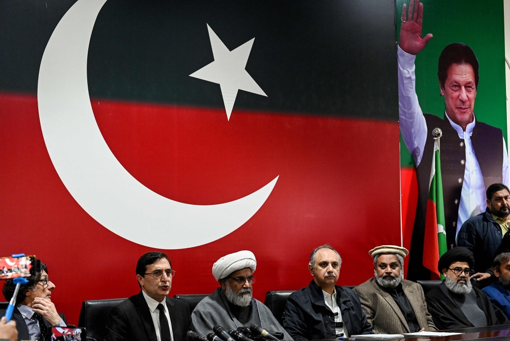 PTI hopes to seek a majority by having its candidates join the Sunni Ittehad Council (SIC), a registered political party whose chairman was the only one from the alliance of Islamic political and religious parties group to win a seat. — AFP pic