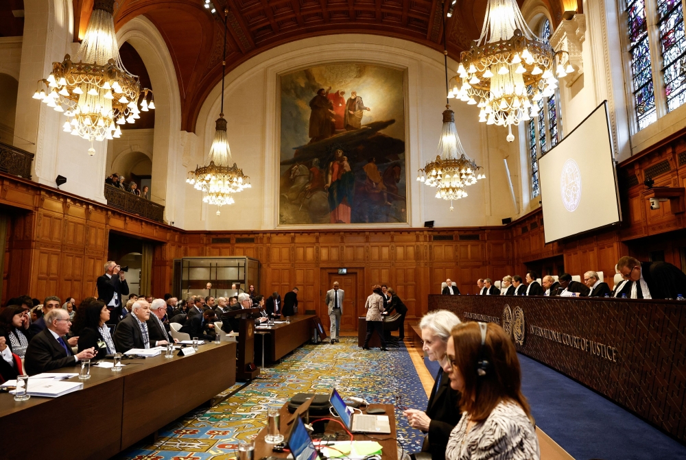 People attend a public hearing held by the International Court of Justice (ICJ) to allow parties to give their views on the legal consequences of Israel's occupation of the Palestinian territories before eventually issuing a non-binding legal opinion in The Hague, Netherlands, February 19, 2024. — Reuters pic