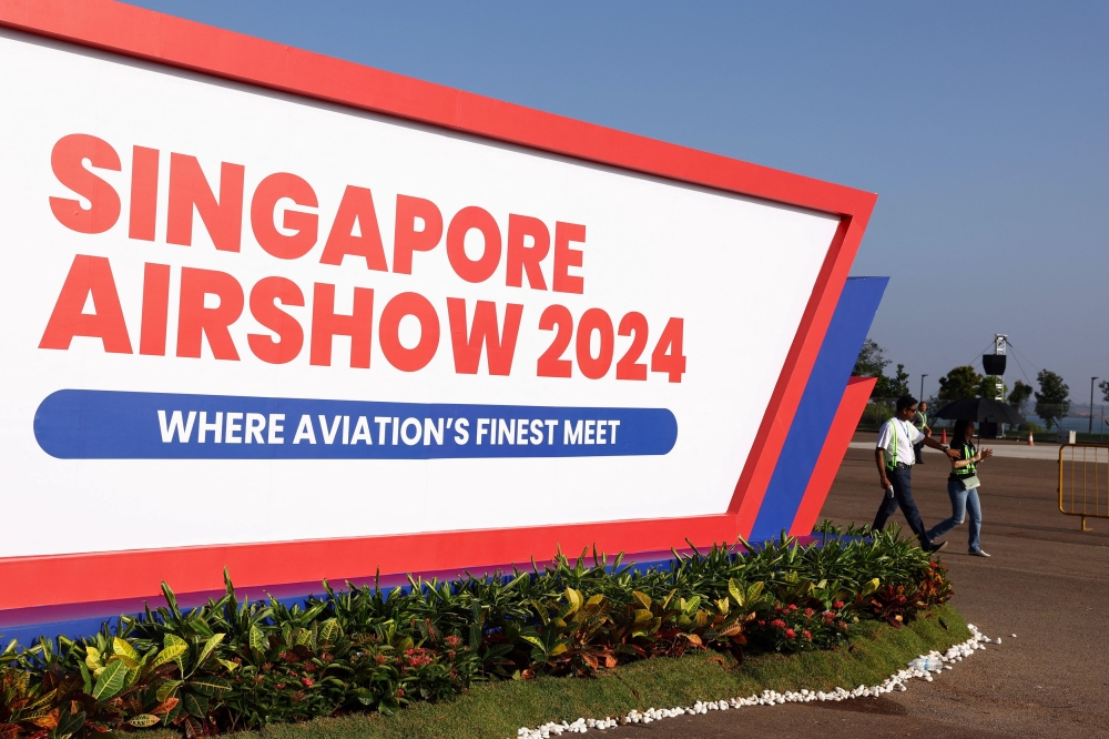 A view of a Singapore Airshow signage ahead of the biennial aerospace event at Changi Exhibition Centre in Singapore February 18, 2024. — Reuters pic
