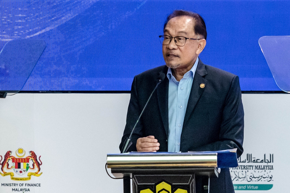 Prime Minister Datuk Seri Anwar Ibrahim speaks at the 15th International Conference on Islamic Economics and Finance at Sasana Kijang in Kuala Lumpur February 20, 2024. — Picture by Firdaus Latif