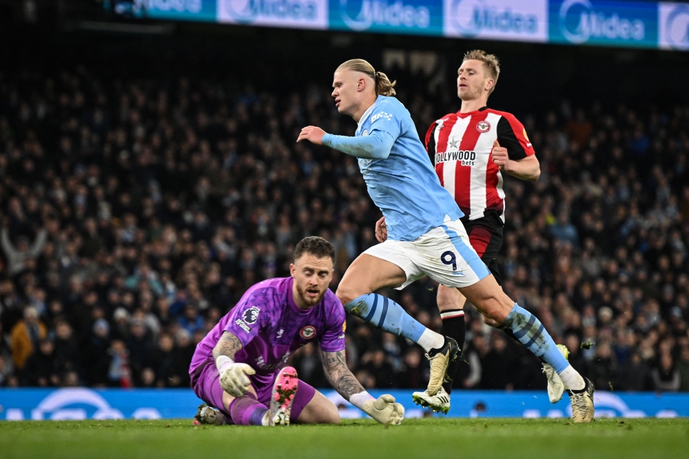 Manchester City's Norwegian striker #09 Erling Haaland (C) celebrates after scoring his team first goal during the English Premier League football match between Manchester City and Brentford at the Etihad Stadium in Manchester February 20, 2024. — AFP pic