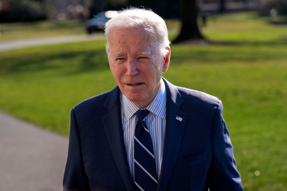US President Joe Biden speaks to members of the press after a weekend in Delaware, on the South Lawn of the White House in Washington February 19, 2024. — Reuters pic