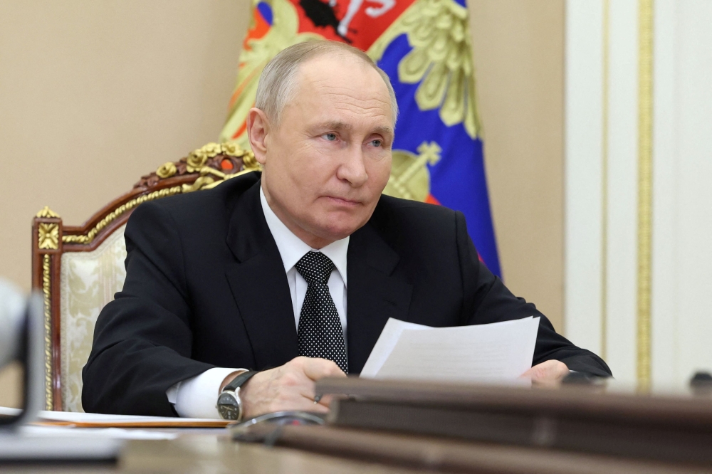 Russian President Vladimir Putin chairs a meeting on capital repairs of schools, via video link in Moscow February 20, 2024. — Picture by Sputnik/Alexander Kazakov/Pool pic via Reuters