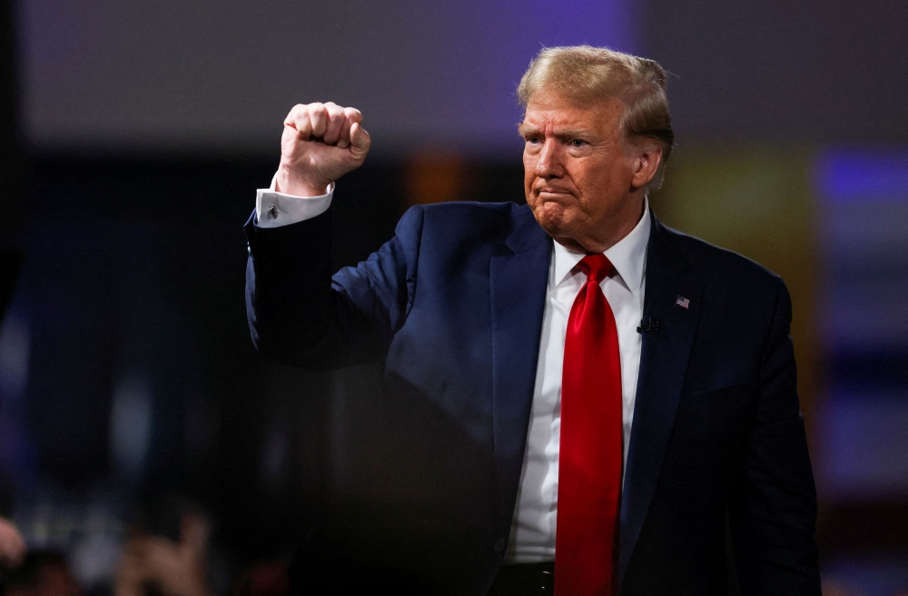 Former US President and Republican presidential candidate Donald Trump gestures as he participates in a Fox News town hall with Laura Ingraham in Greenville, South Carolina February 20, 2024. — Reuters pic