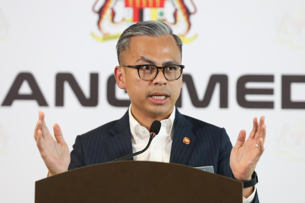 Communications Minister Fahmi Fadzil said he believes that raising the Overnight Policy Rate is not something that will help the people at this time. — Picture by Miera Zulyana
