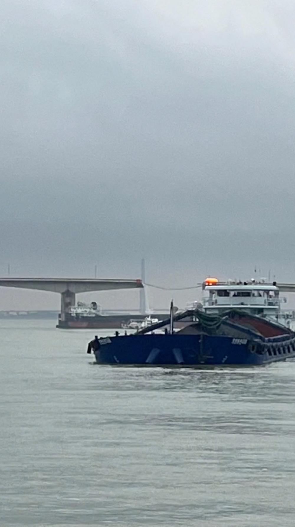 A barge collides with a bridge over a river near Guangzhou, Guangdong, China, February 22, 2024, in this screengrab obtained from a social media video. — Video obtained by Reuters