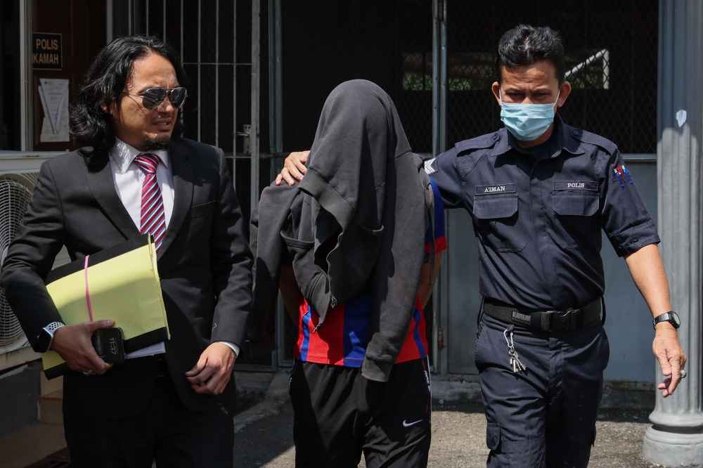 A doctor pleaded not guilty in the Sessions Court in Terengganu to six charges of producing pornography and committing sexual acts while treating six of his child patients from December 2022 to 26 January 2023. The accused, Dr Anas Ramli, 32, (centre) requested to be tried after all the charges were read out. According to the charges, the accused, who currently works at a government hospital in Kuantan, Pahang, was found to have produced pornography in the form of pictures of five of his female patients aged between 7 and 11 years while treating victims at Kemaman Hospital, Terengganu, February 22, 2024. — Bernama pic