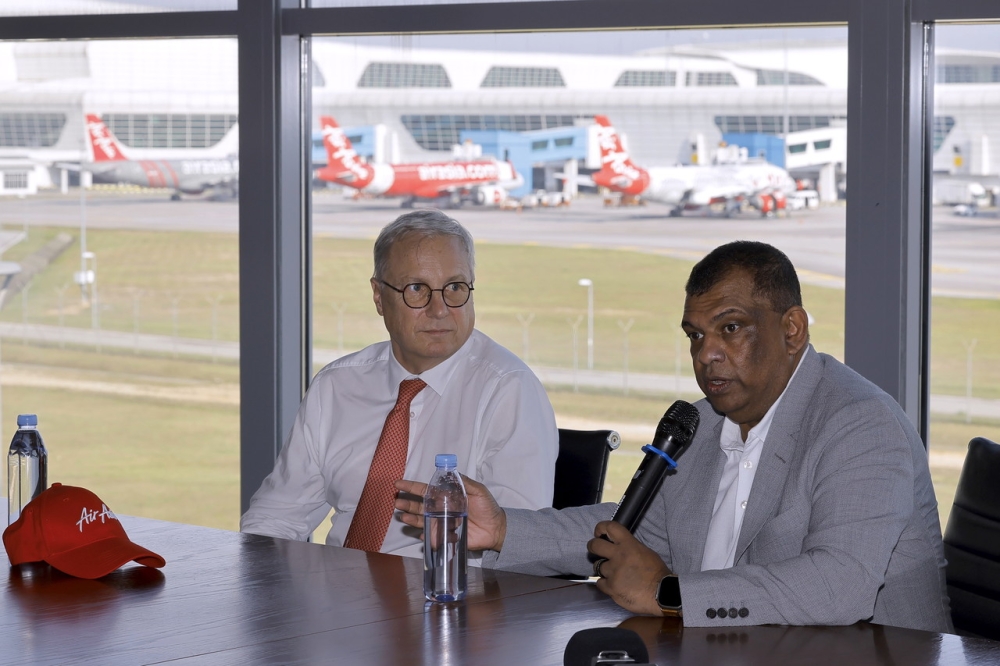 Chief Executive Officer of Capital A Tan Sri Tony Fernandes with Chief Executive Officer of Airbus Commercial Aircraft Christian Scherer (left) during a press conference about partnership and exploring future business opportunities at AirAsia RedQ in Sepang, February 22, 2024. — Bernama pic
