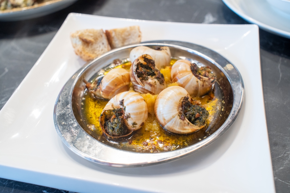 The classic Stuffed Escargots Bourguignon is served with melted butter, garlic and parsley