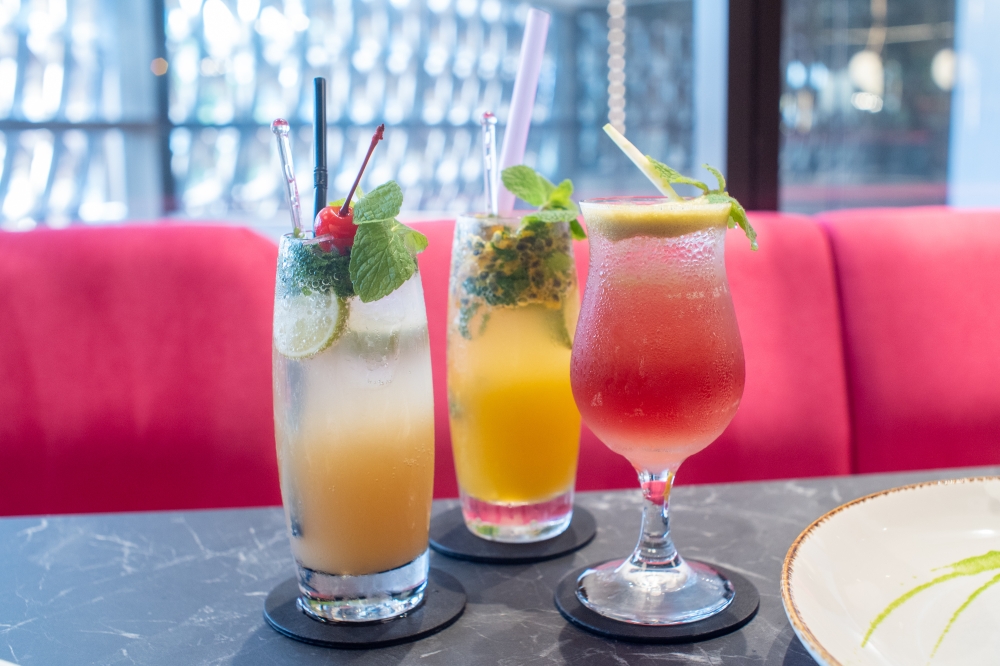 Mocktail mojitos like the Virgin Lychee Mojito (left) and Passion Fruit Mojito (centre) are great to cool down, together with the Mussolini (right) with its combination of apple, lime juice and cranberry juice