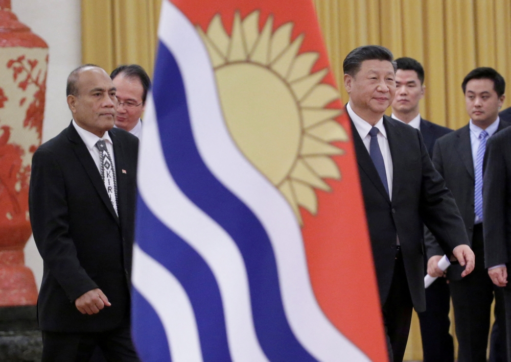 China’s President Xi Jinping and Kiribati’s President Taneti Maamau (left) attend a welcoming ceremony at the Great Hall of the People in Beijing, China January 6, 2020. — Reuters file pic