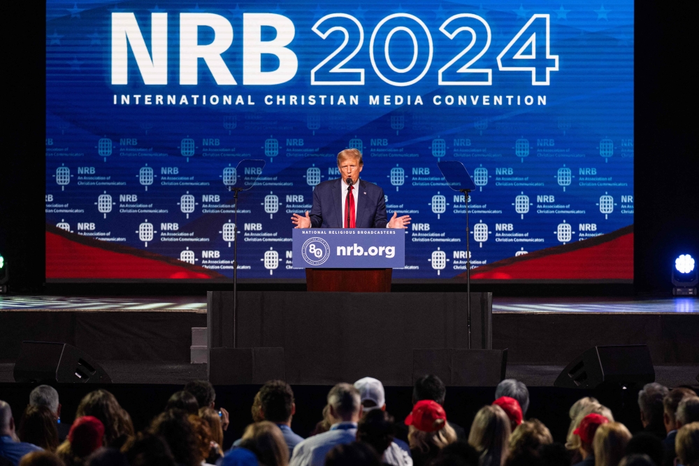 Donald Trump received a warm welcome yesterday when he appeared before an audience of evangelical broadcasters, delivering a campaign-style speech littered with professions of faith and pledges to protect Christians. — AFP pic