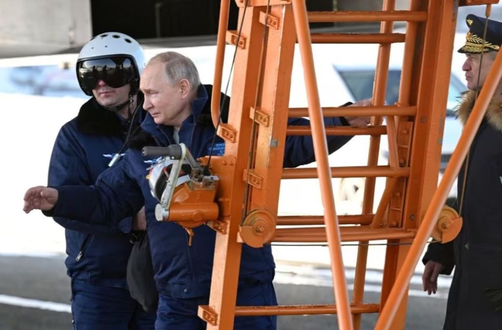 Russian President Vladimir Putin gets ready to fly on a modernised Tu-160M nuclear-capable strategic bomber, in Kazan, Russia, February 22, 2024 Sputnik/Dmitry Azarov/Pool pic via Reuters