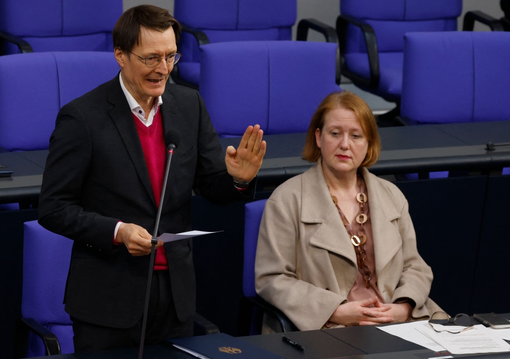 German Minister for Family Affairs, Senior Citizens, Women and Youth Lisa Paus looks on while German Health Minister Karl Lauterbach speaks during a plenary session, as the parliament scheduled the vote on decriminalisation of cannabis at the Bundestag (German lower house of parliament) in Berlin February 23, 2024. — AFP pic