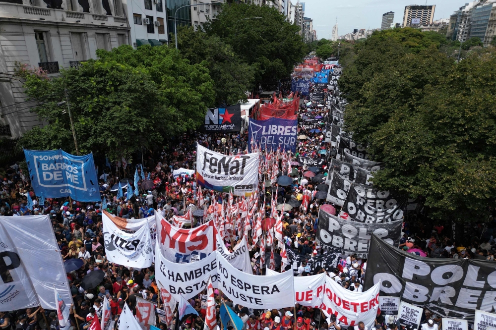 In this aerial view members of social organizations gather outside the Ministry of Human Capital to protest against food scarcity at soup kitchens and President Javier Milei government's austerity plan in Buenos Aires on February 23, 2024. — AFP pic