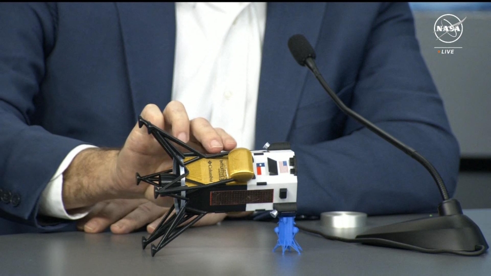 This frame grab from Nasa, shows Intuitive Machines CEO Steve Altemus holding a model of Odysseus to show its position on the side during a press conference at Johnson Space Centre in Houstom, Texas February 23, 2024. — Handout by Nasa TV via AFP