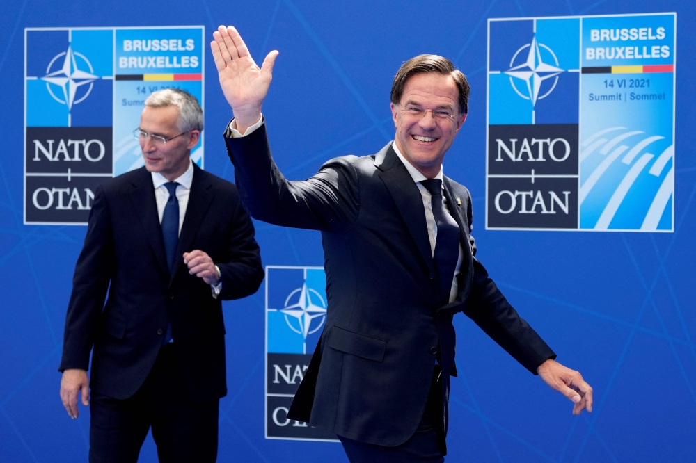 File photo of Nato Secretary General Jens Stoltenberg (left) greeting Netherland’s Prime Minister Mark Rutte for a Nato summit at the North Atlantic Treaty Organization (Nato) headquarters in Brussels, on June 14, 2021. — AFP pic