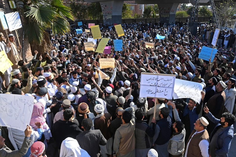Muslims protest against Supreme Court Chief Justice Qazi Faez Isa, in Peshawar on February 23, 2024. — AFP pic