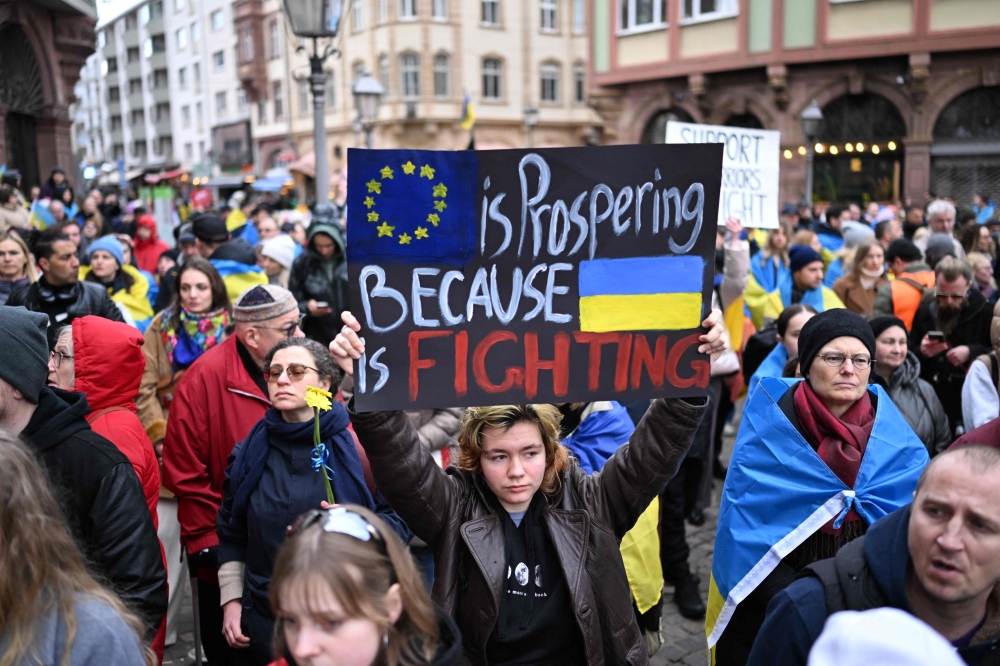 Demonstrators take part in a rally in support of Ukraine, to mark the second year of Russia’s military invasion on Ukraine, in Frankfurt on February 24, 2024. — AFP