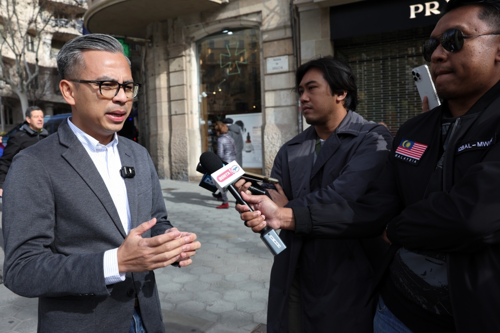 Minister of Communications Fahmi Fadzil speaking to Bernama and RTM reporters in Barcelona where he is leading the Malaysian delegation to the Mobile World Congress Barcelona 2024 (MWC 2024), February 25, 2024. — Bernama pic