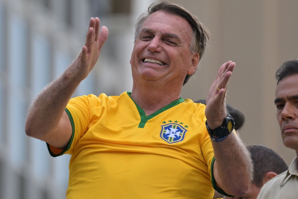Former Brazilian President Jair Bolsonaro gestures during a rally in Sao Paulo, Brazil, on February 25, 2024, to reject claims he plotted a coup with allies to remain in power after his failed 2022 reelection bid. — AFP pic
