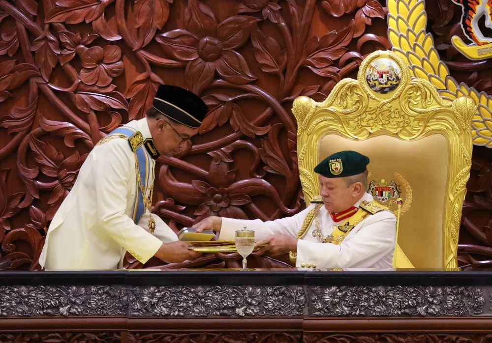 Sultan Ibrahim receives the royal address from Prime Minister Datuk Seri Anwar Ibrahim at the opening of the First Meeting of the Third Session of the 15th Parliament in Dewan Rakyat, February 16, 2024. — Bernama pic 
