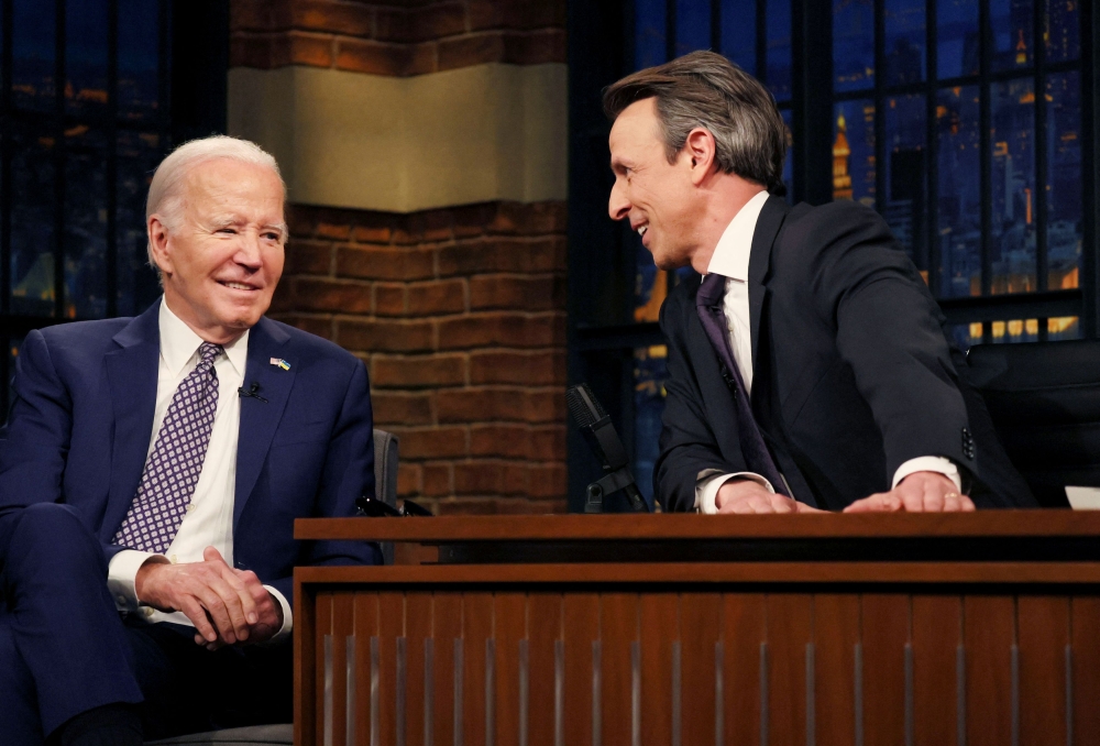 US President Joe Biden laughs during a break in a taped TV interview on NBC’s ‘Late Night With Seth Meyers’ in New York February 26, 2024. — Reuters pic