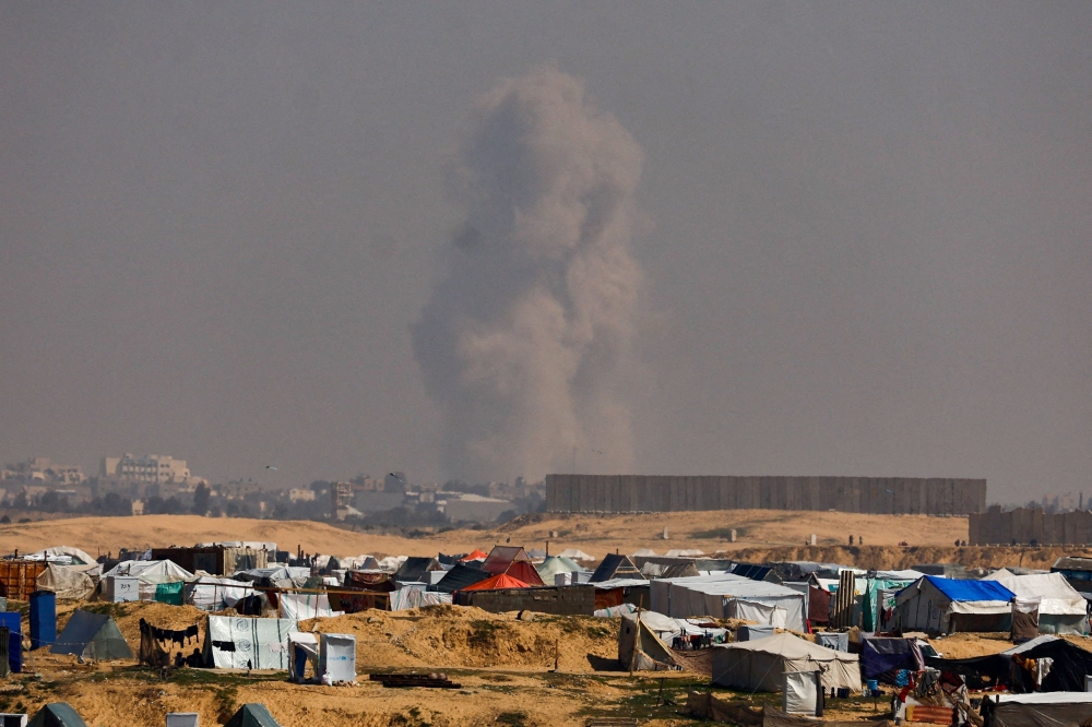 Smoke rises during an Israeli ground operation in Khan Younis, amid the ongoing conflict between Israel and the Palestinian Islamist group Hamas, as seen from a tent camp sheltering displaced Palestinians in Rafah, in the southern Gaza Strip February 26, 2024. — Reuters pic