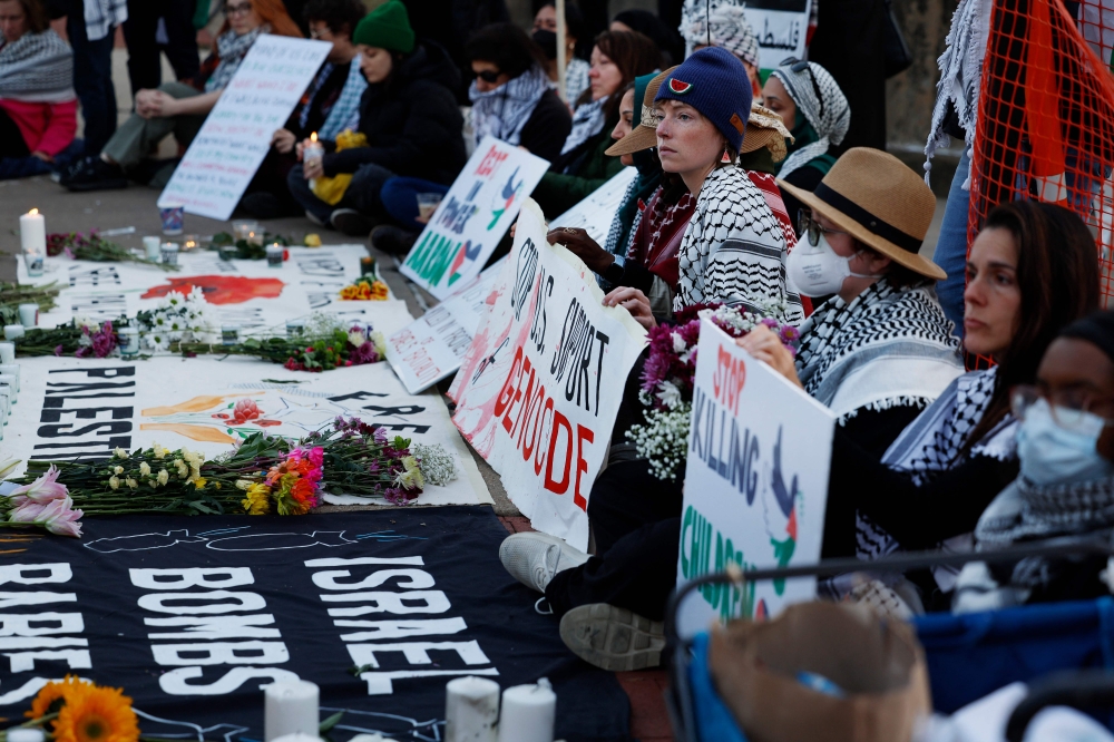 People participate in a vigil for US Air Force active-duty airman Aaron Bushnell outside the Israeli Embassy. — AFP pic