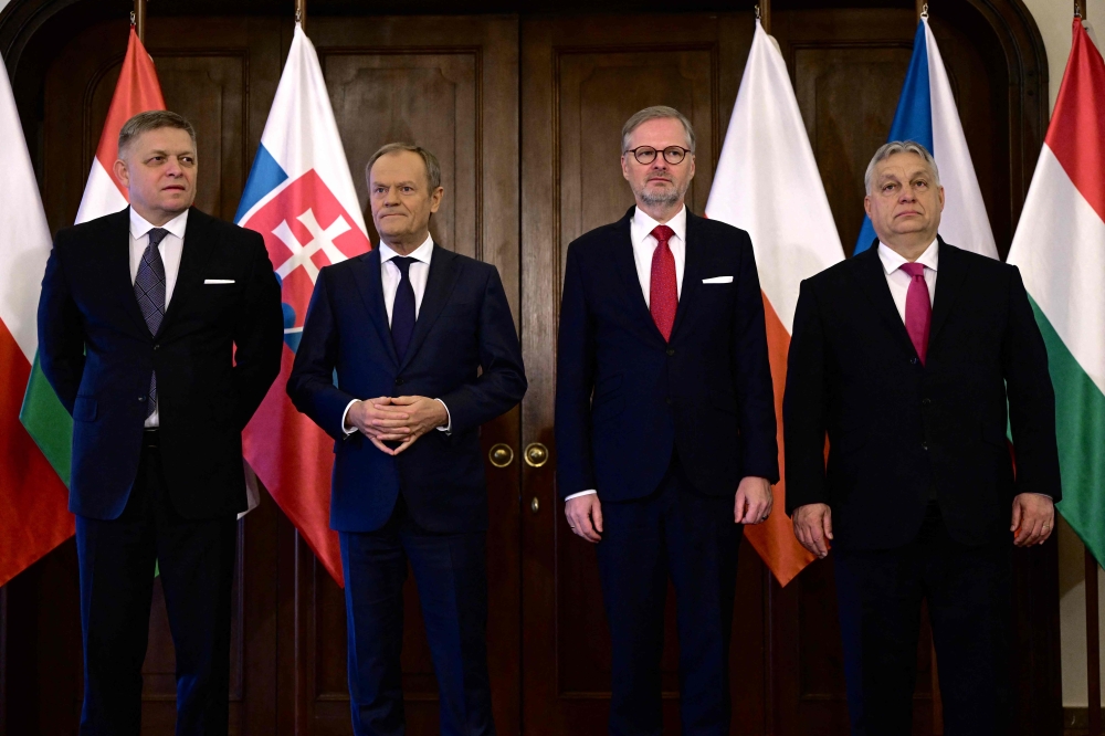 (L-R) Slovakia’s Prime Minister Robert Fico, Poland’s Prime Minister Donald Tusk, Hungary’s Prime Minister Viktor Orban and Czech Republic’s Prime Minister Petr Fiala pose for a family picture prior to the Visegrad Group (V4) meeting on February 27, 2024 in Prague, Czech Republic. — AFP pic