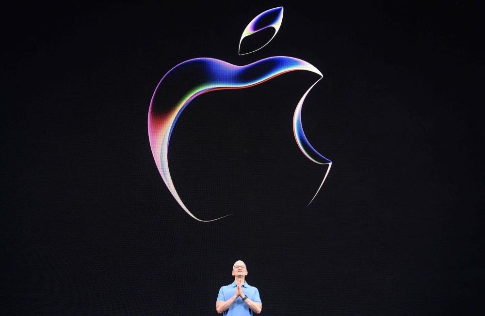 Apple plans to disclose more about its plans to put generative artificial intelligence to use later this year, Chief Executive Officer Tim Cook said during the company’s annual shareholder meeting on Wednesday. — AFP pic