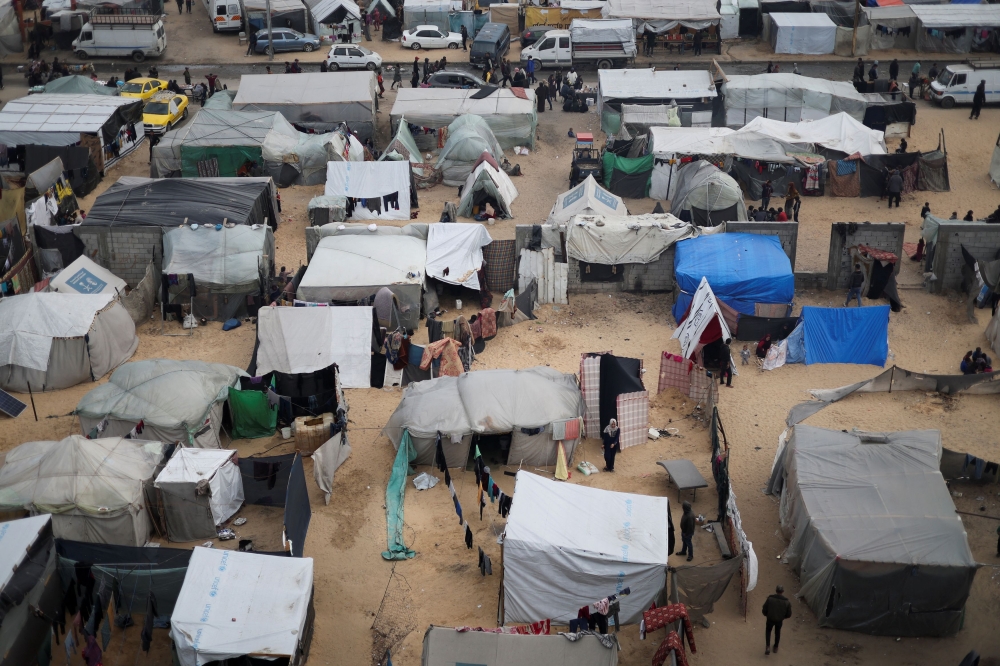 Displaced Palestinians, who fled their houses due to Israeli strikes, shelter at a tent camp, amid the ongoing conflict between Israel and Hamas, in Rafah in the southern Gaza Strip, February 27, 2024. — Reuters pic