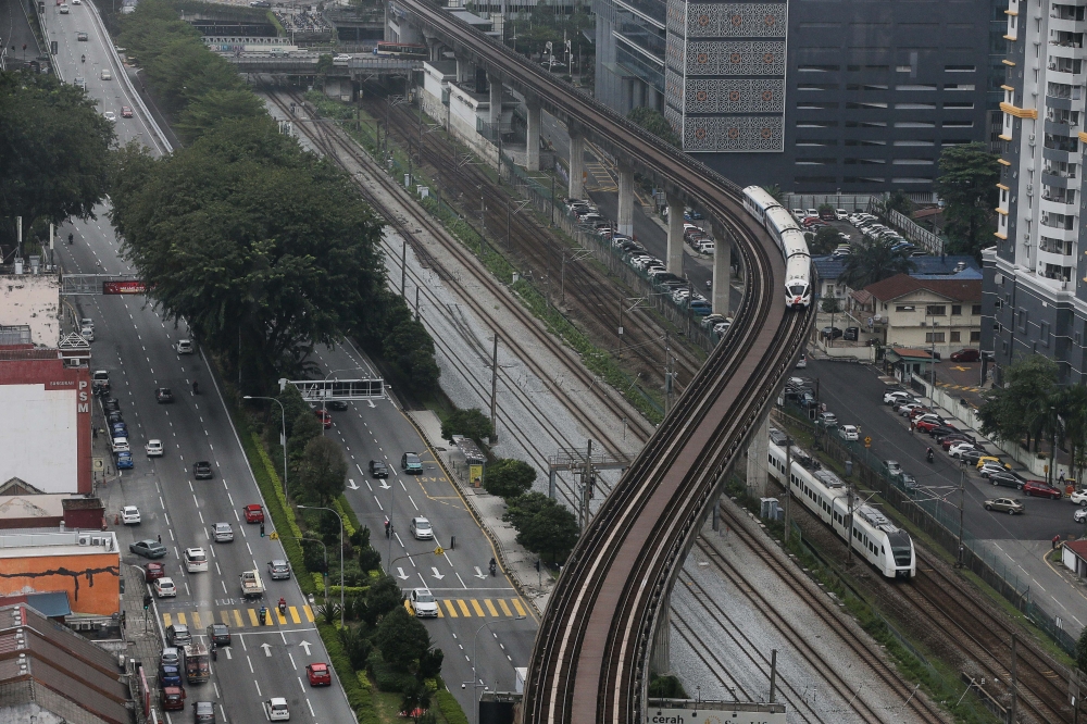 The LRT is pictured crossing the area that can be seen from Menara UOA, Bangsar. Selangor Investment, Trade and Mobility Exco Ng Sze Han said the LRT3 Project is expected to be fully completed and start operating in March 2025. —  Picture by Sayuti Zainudin
