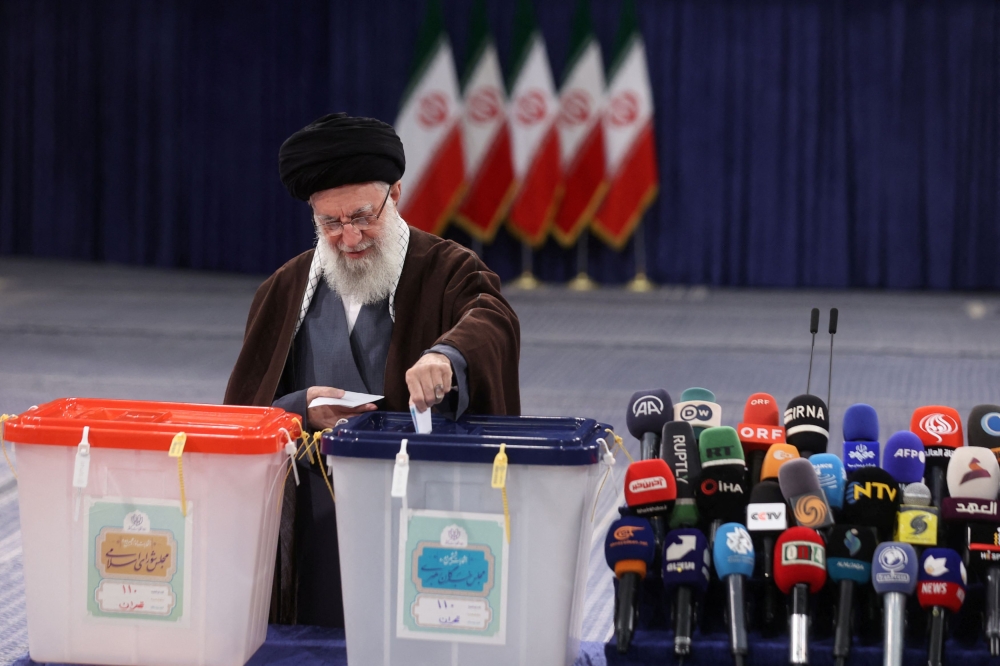 Iran’s Supreme Leader Ayatollah Ali Khamenei casts his vote during parliamentary elections in Tehran. — Reuters pic/West Asia News Agency