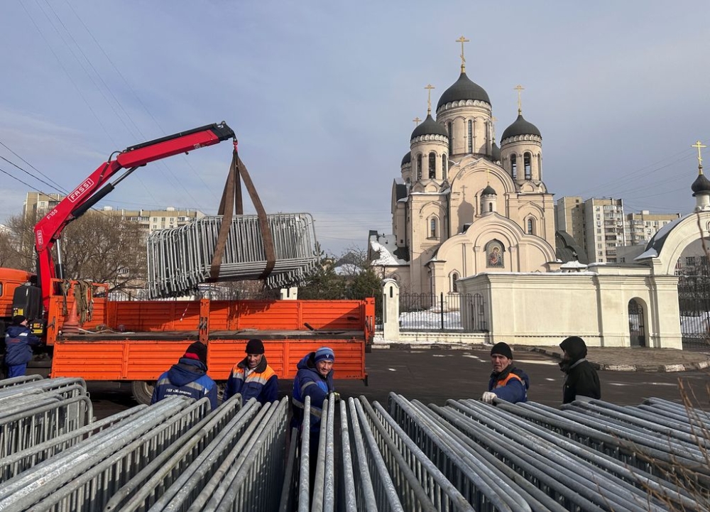 Workers place barriers in front of the Church of the Icon of the Mother of God, where service for Alexei Navalny, the Russian opposition leader who died in a prison camp, is expected to be held in Moscow, Russia, February 29, 2024. — Reuters pic