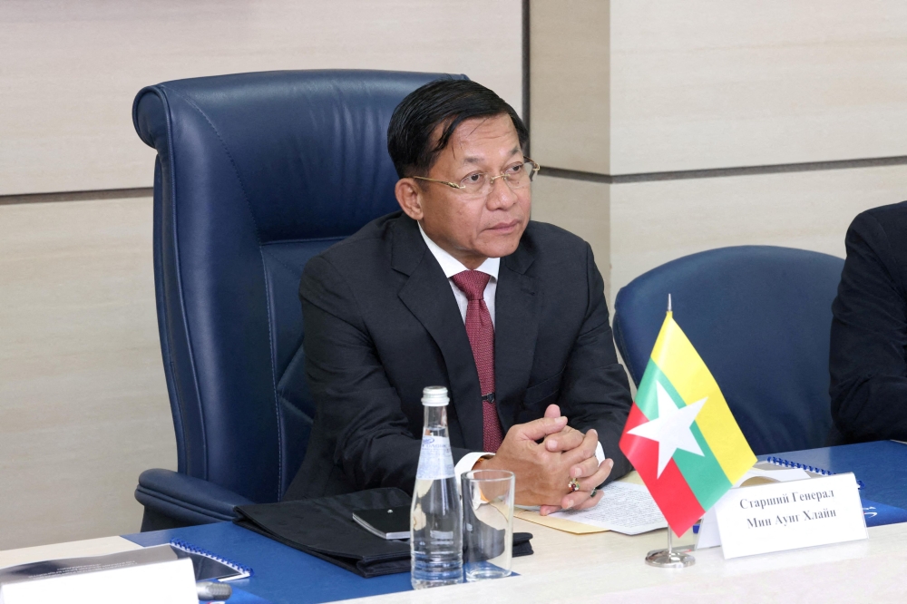 File photo of Myanmar’s Prime Minister and State Administrative Council Chairman Min Aung Hlaing attending a meeting with Director General of Roscosmos Dmitry Rogozin in Moscow, Russia July 12, 2022. — Reuters pic